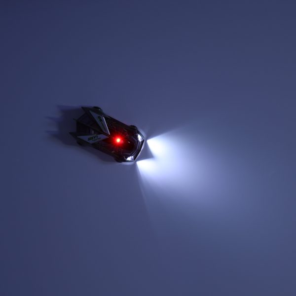 RC laser-controlled car driving on a wall on laser grey